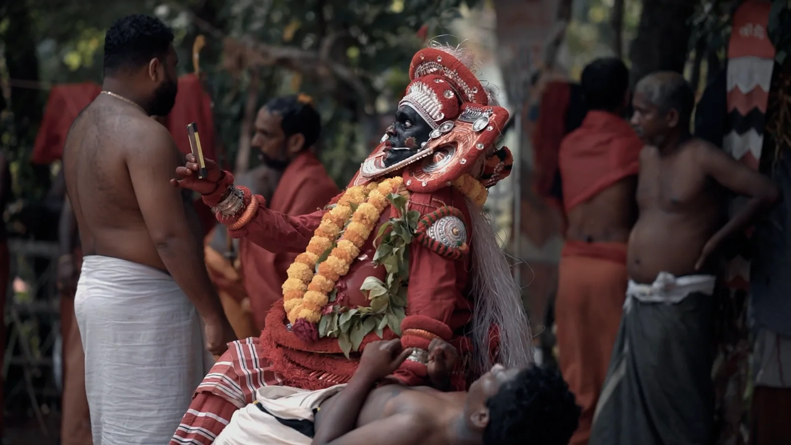 Thirayattam performer receiving devotees