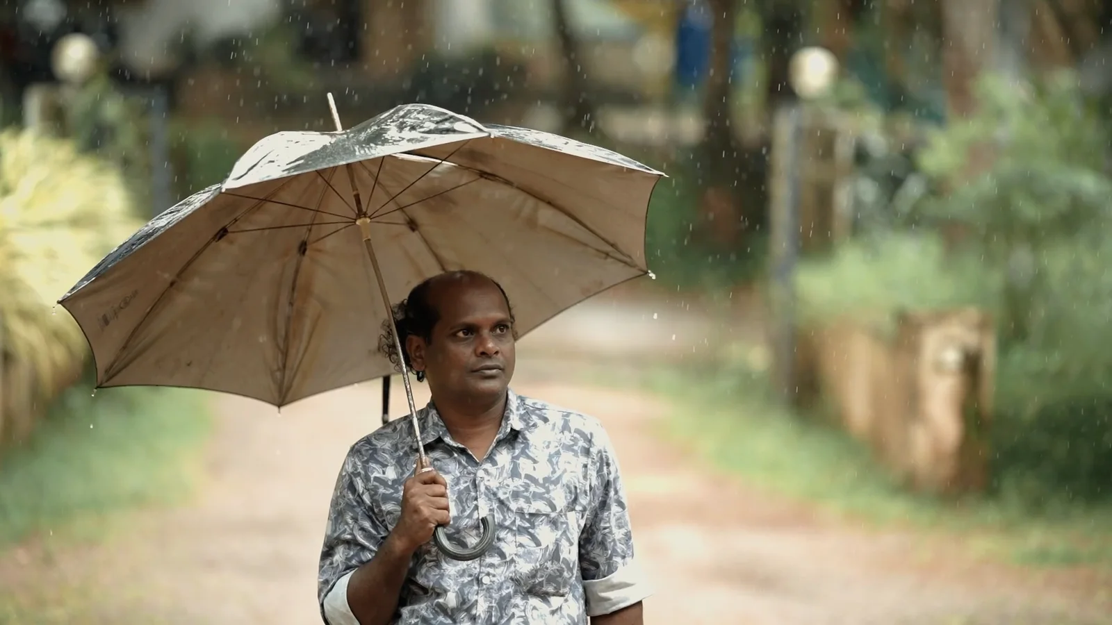 Gopi walking in rain